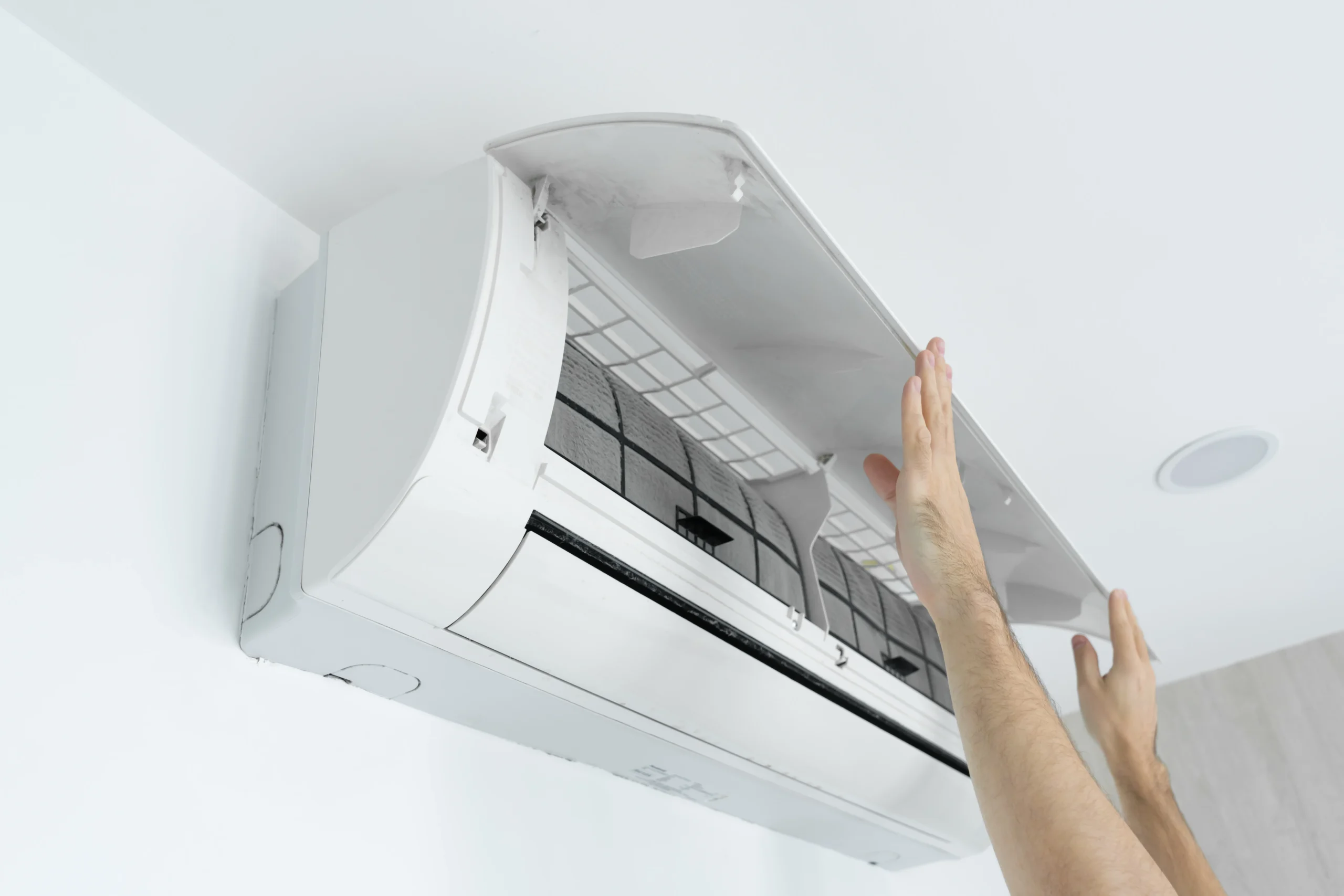 guy cleans filter home air conditioner from dust scaled